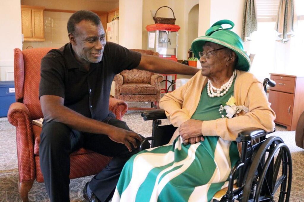 Dan Whitehead talks with his grandmother, Namoi Whitehead, at St. Paul’s Senior Living Community in West Salem Township. She celebrated her 113th birthday on Tuesday.