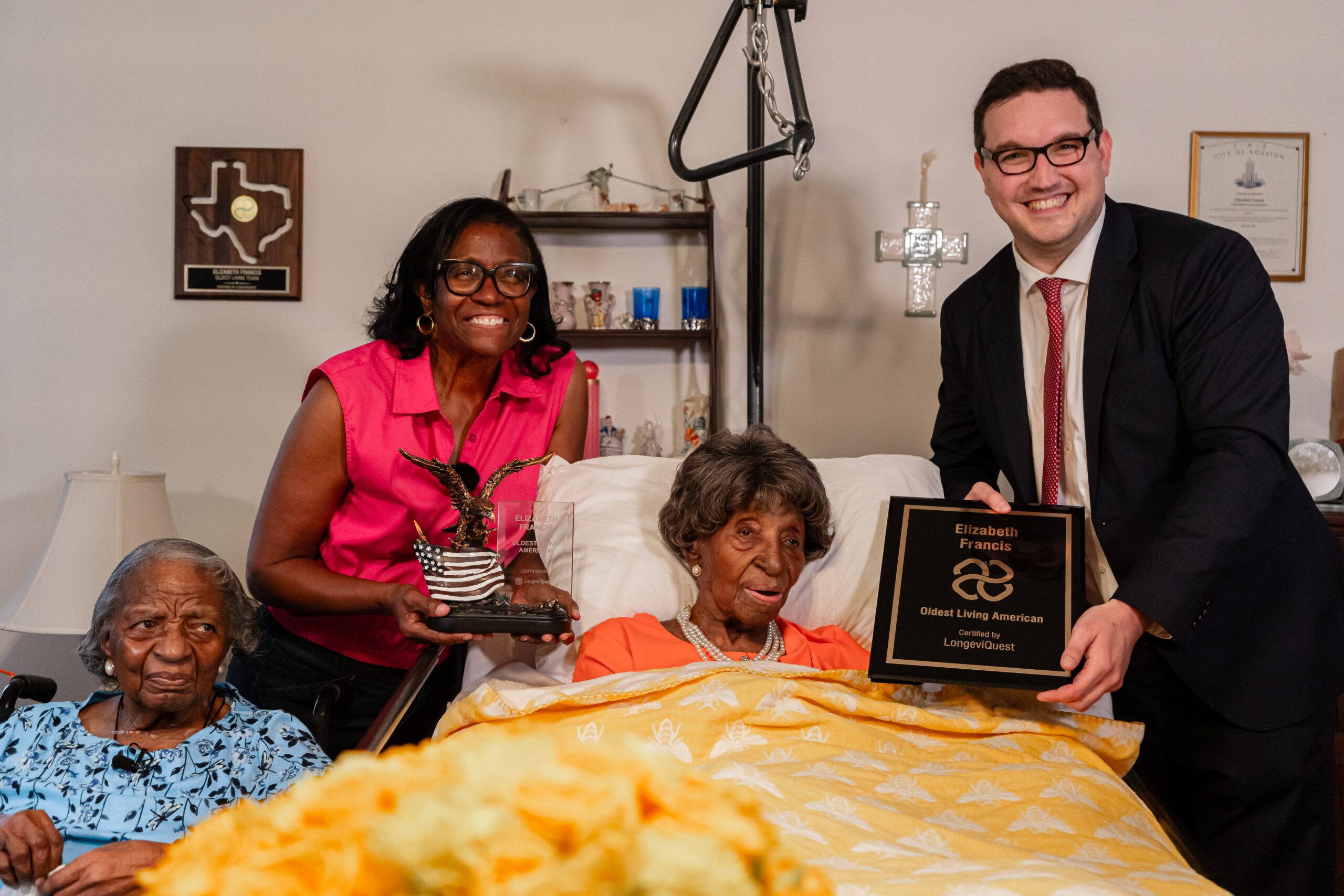 Ms. Francis receiving her latest accolades. From left: Dorothy Williams, Ethel Harrison, Elizabeth Francis, Ben Meyers (LongeviQuest, article author) | photo by Emmanuel Rodriguez (@supermannyphoto) | © LongeviQuest